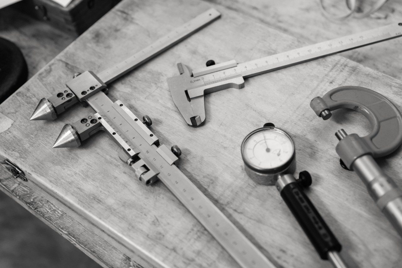 Metal measuring instruments on a wooden table