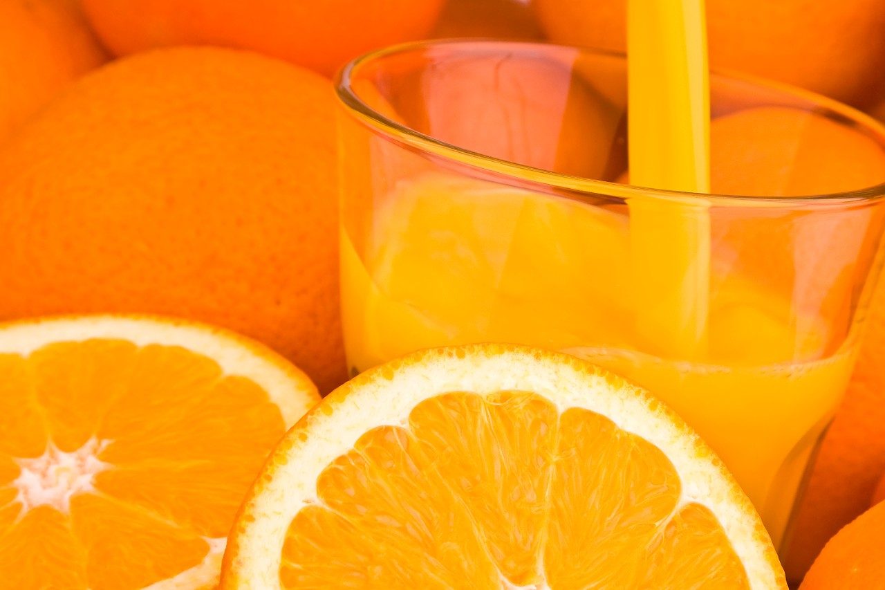 Orange juice pouring into glass