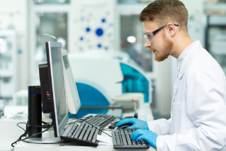 Scientist looking at data on computer